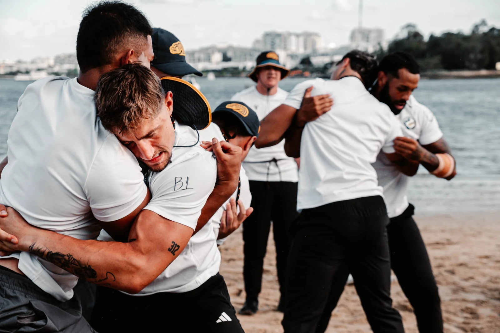 Athletes wrestling during a Parra camp training session